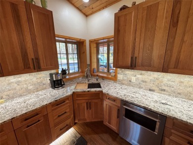 Beautiful open concept single level custom home overlooking the on Double Arrow Lodge in Montana - for sale on GolfHomes.com, golf home, golf lot