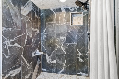 Beautifully updated 3 bedroom, 2 bath pool home in desirable on Daytona Beach Golf Club in Florida - for sale on GolfHomes.com, golf home, golf lot