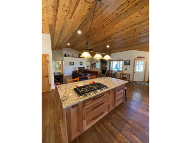 Beautiful open concept single level custom home overlooking the on Double Arrow Lodge in Montana - for sale on GolfHomes.com, golf home, golf lot