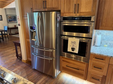 Beautiful open concept single level custom home overlooking the on Double Arrow Lodge in Montana - for sale on GolfHomes.com, golf home, golf lot