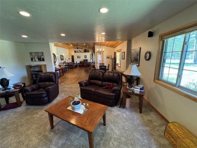 Beautiful open concept single level custom home overlooking the on Double Arrow Lodge in Montana - for sale on GolfHomes.com, golf home, golf lot