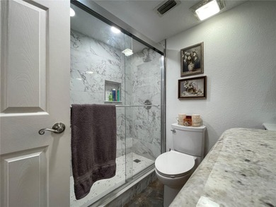 EXQUISITE Lakefront 55+ Residence | 2 Bed | 2 Bath | Private on Country Club At Silver Springs Shores in Florida - for sale on GolfHomes.com, golf home, golf lot