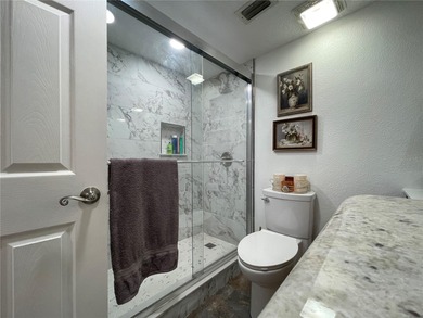 EXQUISITE Lakefront 55+ Residence | 2 Bed | 2 Bath | Private on Country Club At Silver Springs Shores in Florida - for sale on GolfHomes.com, golf home, golf lot