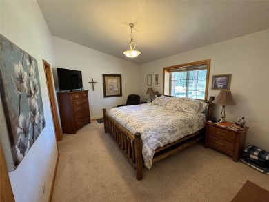 Beautiful open concept single level custom home overlooking the on Double Arrow Lodge in Montana - for sale on GolfHomes.com, golf home, golf lot