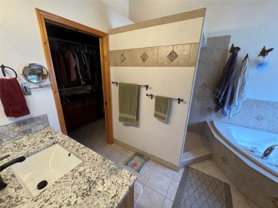Beautiful open concept single level custom home overlooking the on Double Arrow Lodge in Montana - for sale on GolfHomes.com, golf home, golf lot