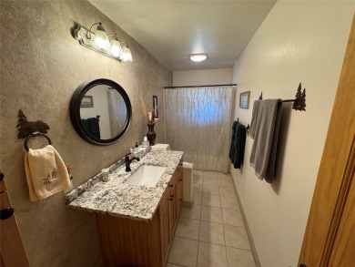 Beautiful open concept single level custom home overlooking the on Double Arrow Lodge in Montana - for sale on GolfHomes.com, golf home, golf lot