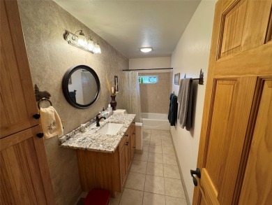Beautiful open concept single level custom home overlooking the on Double Arrow Lodge in Montana - for sale on GolfHomes.com, golf home, golf lot