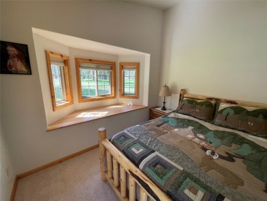 Beautiful open concept single level custom home overlooking the on Double Arrow Lodge in Montana - for sale on GolfHomes.com, golf home, golf lot