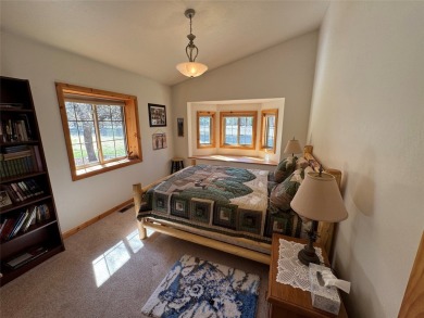 Beautiful open concept single level custom home overlooking the on Double Arrow Lodge in Montana - for sale on GolfHomes.com, golf home, golf lot
