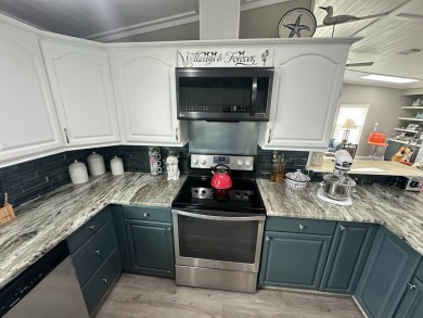 Lot Rent $1075 monthly     This beautiful 2-bedroom, 2 bathroom on Del Tura Golf and Country Club in Florida - for sale on GolfHomes.com, golf home, golf lot