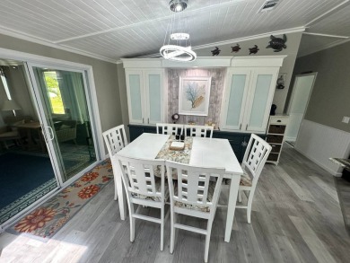 Lot Rent $1075 monthly     This beautiful 2-bedroom, 2 bathroom on Del Tura Golf and Country Club in Florida - for sale on GolfHomes.com, golf home, golf lot