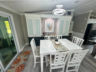 Lot Rent $1075 monthly     This beautiful 2-bedroom, 2 bathroom on Del Tura Golf and Country Club in Florida - for sale on GolfHomes.com, golf home, golf lot