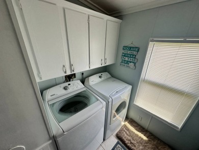 Lot Rent $1075 monthly     This beautiful 2-bedroom, 2 bathroom on Del Tura Golf and Country Club in Florida - for sale on GolfHomes.com, golf home, golf lot