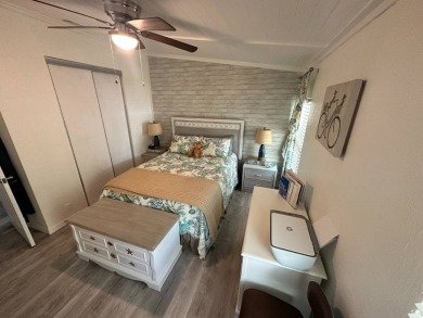Lot Rent $1075 monthly     This beautiful 2-bedroom, 2 bathroom on Del Tura Golf and Country Club in Florida - for sale on GolfHomes.com, golf home, golf lot
