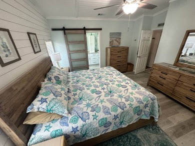 Lot Rent $1075 monthly     This beautiful 2-bedroom, 2 bathroom on Del Tura Golf and Country Club in Florida - for sale on GolfHomes.com, golf home, golf lot