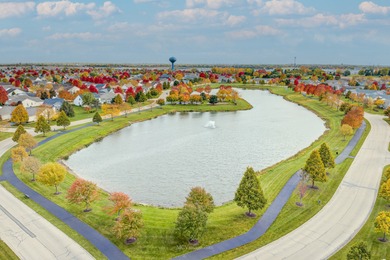 Welcome to this beautiful RANCH townhome situated on a premium on Carillon Lakes 3 Hole Course in Illinois - for sale on GolfHomes.com, golf home, golf lot