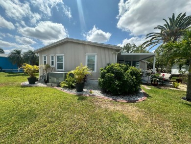 Lot Rent $1075 monthly     This beautiful 2-bedroom, 2 bathroom on Del Tura Golf and Country Club in Florida - for sale on GolfHomes.com, golf home, golf lot