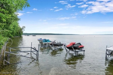 Welcome to your dream lakeside retreat on Burt Lake! Stunning on Indian River Golf Club in Michigan - for sale on GolfHomes.com, golf home, golf lot