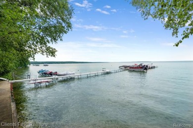 Welcome to your dream lakeside retreat on Burt Lake! Stunning on Indian River Golf Club in Michigan - for sale on GolfHomes.com, golf home, golf lot