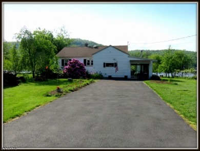 Proudly offered by the son of the first owner, this hidden gem on Lake Lackawanna Golf Course in New Jersey - for sale on GolfHomes.com, golf home, golf lot