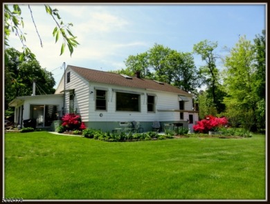 Proudly offered by the son of the first owner, this hidden gem on Lake Lackawanna Golf Course in New Jersey - for sale on GolfHomes.com, golf home, golf lot