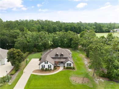 Situated within the prestigious gated community of Oak Grove on Oak Grove Island Golf and Country Club in Georgia - for sale on GolfHomes.com, golf home, golf lot