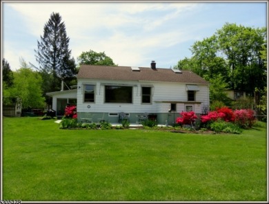 Proudly offered by the son of the first owner, this hidden gem on Lake Lackawanna Golf Course in New Jersey - for sale on GolfHomes.com, golf home, golf lot