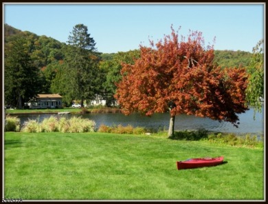 Proudly offered by the son of the first owner, this hidden gem on Lake Lackawanna Golf Course in New Jersey - for sale on GolfHomes.com, golf home, golf lot