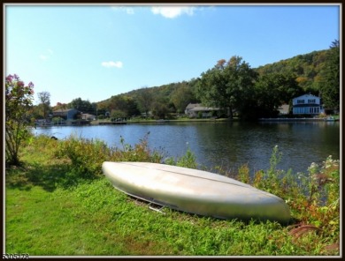 Proudly offered by the son of the first owner, this hidden gem on Lake Lackawanna Golf Course in New Jersey - for sale on GolfHomes.com, golf home, golf lot