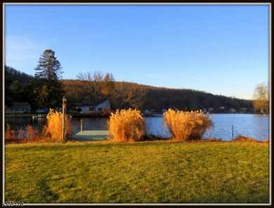 Proudly offered by the son of the first owner, this hidden gem on Lake Lackawanna Golf Course in New Jersey - for sale on GolfHomes.com, golf home, golf lot