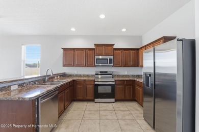 One or more photo(s) has been virtually staged. Located within on Sherman Hills Golf Club in Florida - for sale on GolfHomes.com, golf home, golf lot