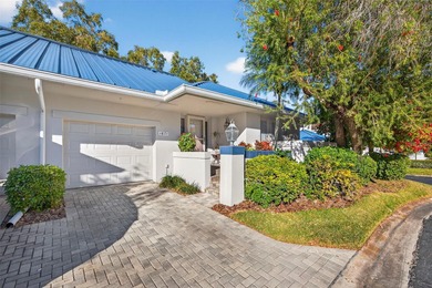 Thoughtfully updated end-unit residence in the desirable on Mangrove Bay Golf Course in Florida - for sale on GolfHomes.com, golf home, golf lot