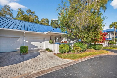 Thoughtfully updated end-unit residence in the desirable on Mangrove Bay Golf Course in Florida - for sale on GolfHomes.com, golf home, golf lot
