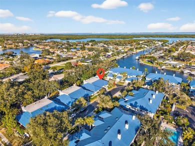 Thoughtfully updated end-unit residence in the desirable on Mangrove Bay Golf Course in Florida - for sale on GolfHomes.com, golf home, golf lot