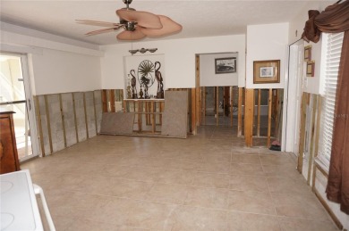 Spanish style WATERFRONT home located in desirable deed on Saint Andrews South Golf Club in Florida - for sale on GolfHomes.com, golf home, golf lot