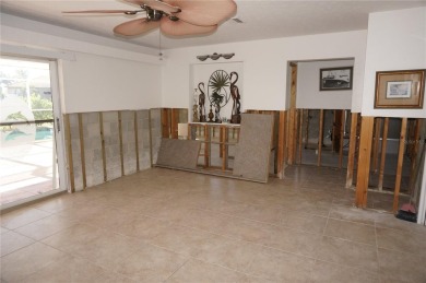 Spanish style WATERFRONT home located in desirable deed on Saint Andrews South Golf Club in Florida - for sale on GolfHomes.com, golf home, golf lot