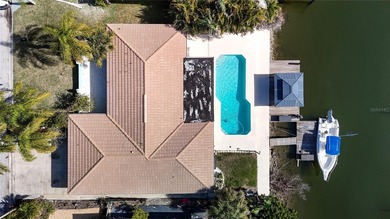 Must see beautiful waterfront pool home in the highly sought on Gulf Harbors Golf Course in Florida - for sale on GolfHomes.com, golf home, golf lot