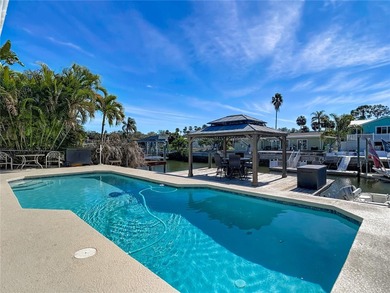 Must see beautiful waterfront pool home in the highly sought on Gulf Harbors Golf Course in Florida - for sale on GolfHomes.com, golf home, golf lot