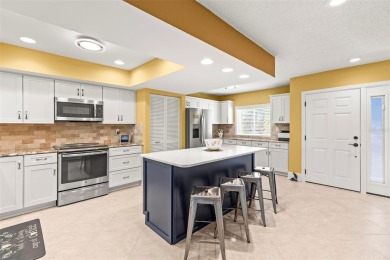 WHAT AN AMAZING HIGH END REMODEL WITH NOTHING  LEFT UNDONE on Bardmoor Golf and Tennis Club in Florida - for sale on GolfHomes.com, golf home, golf lot