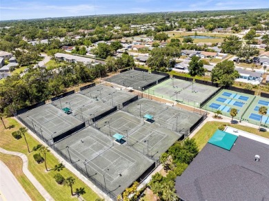 WHAT AN AMAZING HIGH END REMODEL WITH NOTHING  LEFT UNDONE on Bardmoor Golf and Tennis Club in Florida - for sale on GolfHomes.com, golf home, golf lot