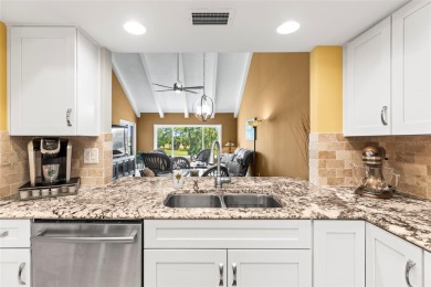 WHAT AN AMAZING HIGH END REMODEL WITH NOTHING  LEFT UNDONE on Bardmoor Golf and Tennis Club in Florida - for sale on GolfHomes.com, golf home, golf lot