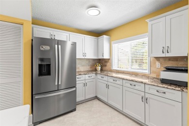 WHAT AN AMAZING HIGH END REMODEL WITH NOTHING  LEFT UNDONE on Bardmoor Golf and Tennis Club in Florida - for sale on GolfHomes.com, golf home, golf lot