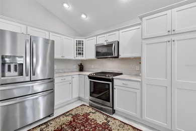 STUNNING, BLOCK and STUCCO 3/2 IRIS with GLASS ENCLOSED LANAI on Pennbrooke Fairways in Florida - for sale on GolfHomes.com, golf home, golf lot