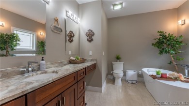 Welcome to this 6-bedroom, 4-full bath home, perfectly on Seasons Ridge At Four Seasons in Missouri - for sale on GolfHomes.com, golf home, golf lot