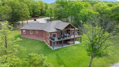 Welcome to this 6-bedroom, 4-full bath home, perfectly on Seasons Ridge At Four Seasons in Missouri - for sale on GolfHomes.com, golf home, golf lot