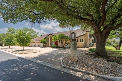 Exquisite and stylishly updated golf course home with enclosed on Slick Rock Golf Course - Horseshoe Bay in Texas - for sale on GolfHomes.com, golf home, golf lot