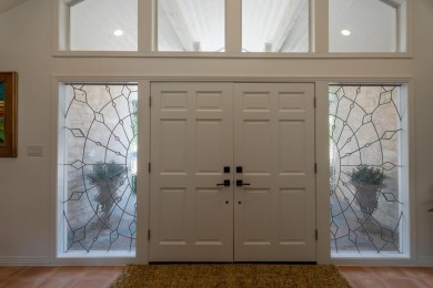 Exquisite and stylishly updated golf course home with enclosed on Slick Rock Golf Course - Horseshoe Bay in Texas - for sale on GolfHomes.com, golf home, golf lot