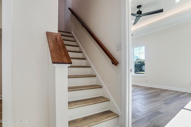 Step into paradise at 115 Genoes Point Road SW, where coastal on Lockwood Folly Country Club in North Carolina - for sale on GolfHomes.com, golf home, golf lot