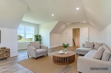 Step into paradise at 115 Genoes Point Road SW, where coastal on Lockwood Folly Country Club in North Carolina - for sale on GolfHomes.com, golf home, golf lot