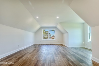 Step into paradise at 115 Genoes Point Road SW, where coastal on Lockwood Folly Country Club in North Carolina - for sale on GolfHomes.com, golf home, golf lot